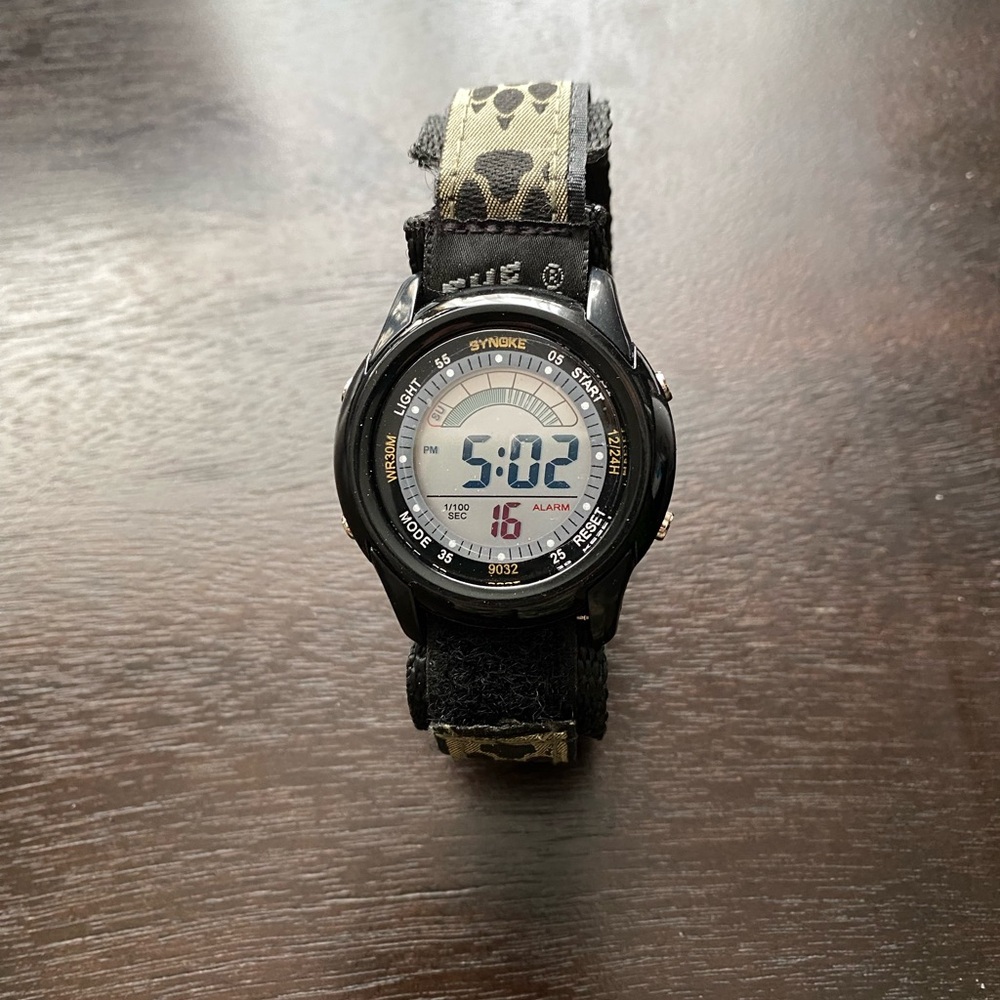 Digital watch with military cover and band